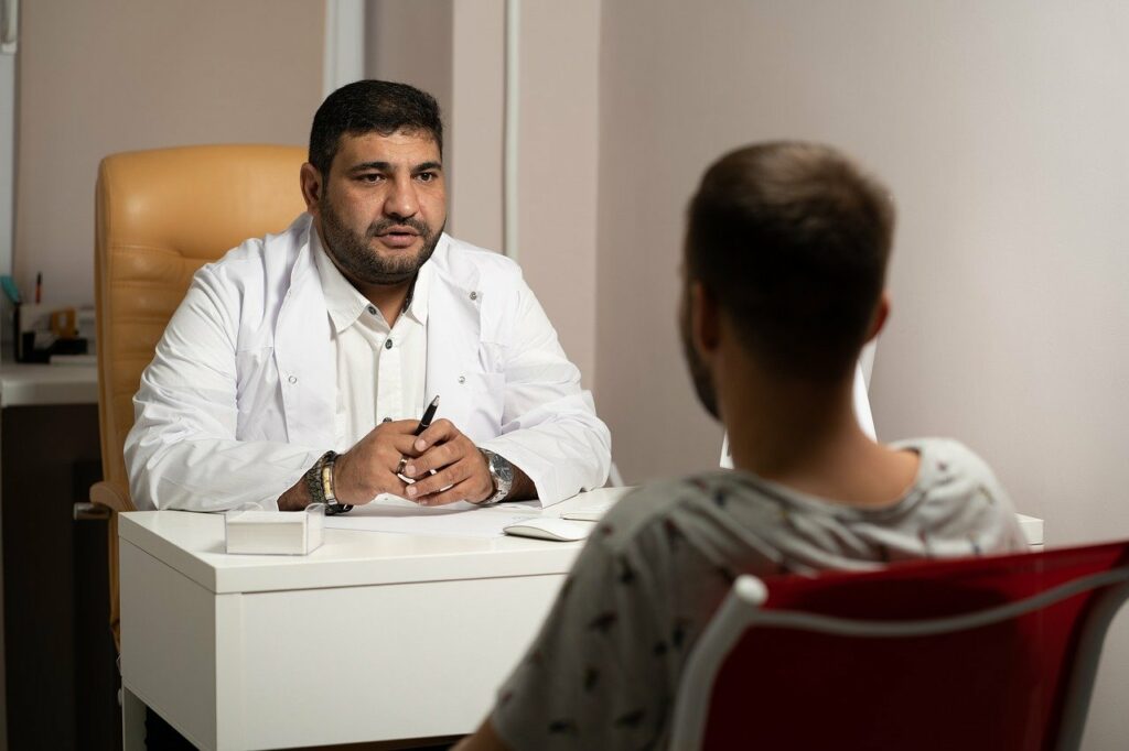 Ketamine Doctor sitting with fibromyalgia patient who asks him about treatment options for Fibromyalgia.