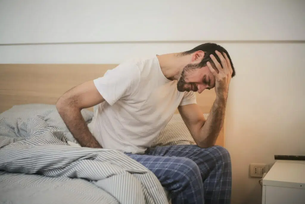 Man holding his head because of chronic pain