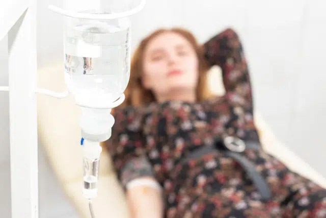 Patient getting IV therapy infusion during hangover