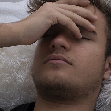Man having a fever cause of over fatigue