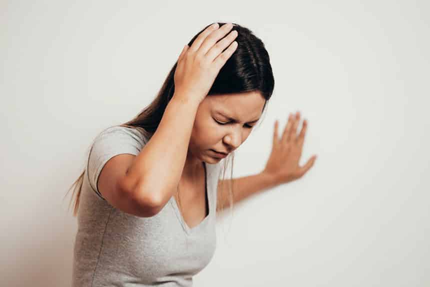 Young woman suffering from severe pain cause of migraine