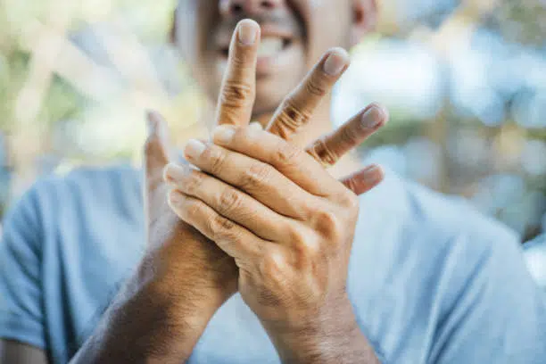 Man suffering from Peripheral Neuropathy pain on his hand