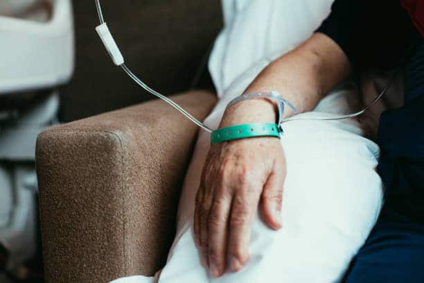 Patient having Ketamine Treatment for Peripheral Neuropathy pain- cropped focused on the hand