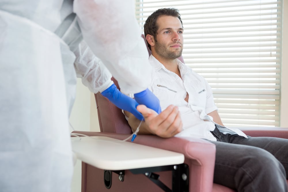 man getting an iv therapy for dehydration