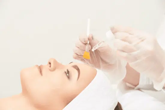 Woman under going GLAMOR PEELING procedure in the clinic.