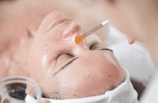 Woman doing some GlamourPeel/Skin Peeling in the clinic 