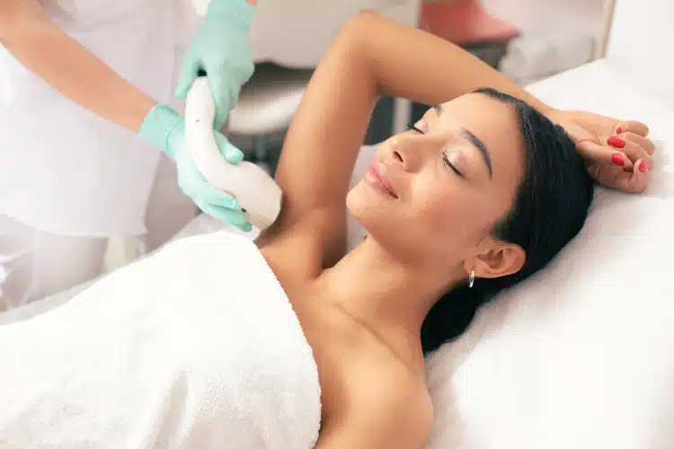 Woman having her hair laser removal treatment at the clinic.