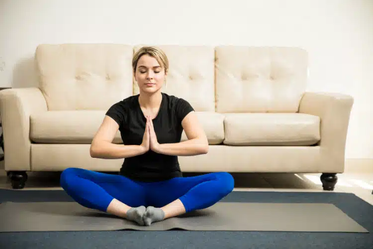 woman meditating and doing some yoga.