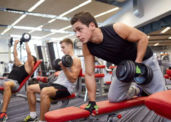 Man in the gym doing some physical exercises.